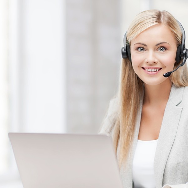 woman wearing a headset at a computer